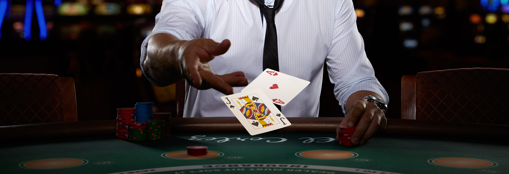 blackjack table, player and cards